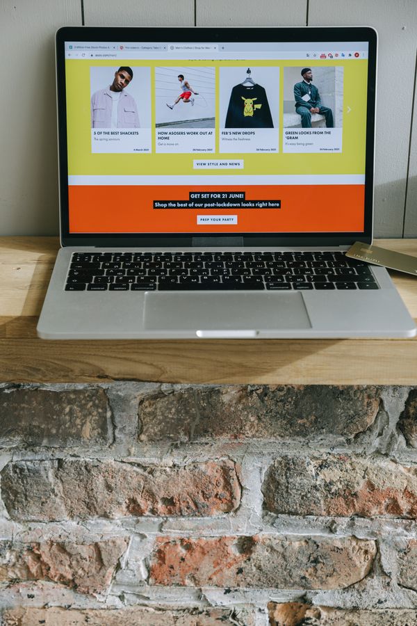 Laptop showing a colorful online shopping webpage, representing digital marketing